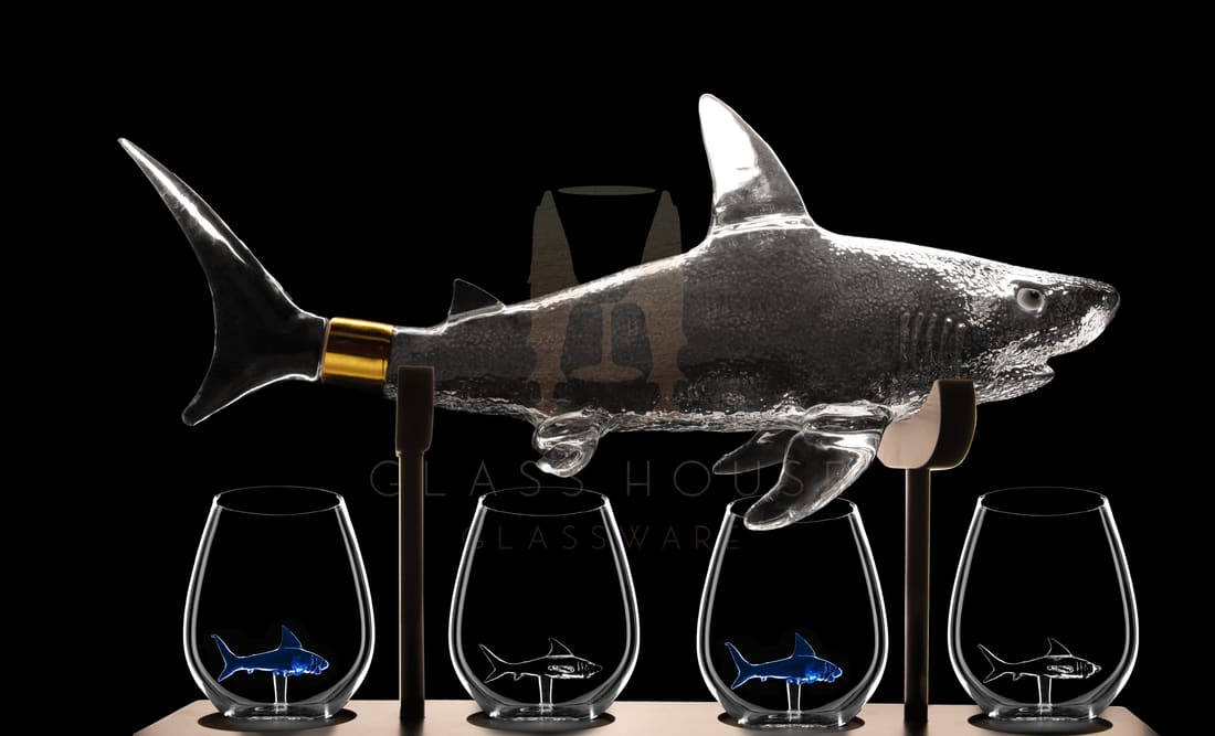 Shark decanter with four stemless glasses on a stand